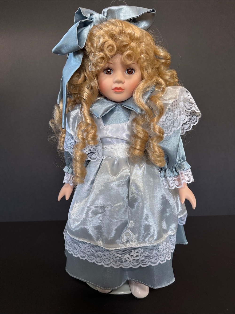 Porcelain Fashion Doll in Light Blue Satin Dress